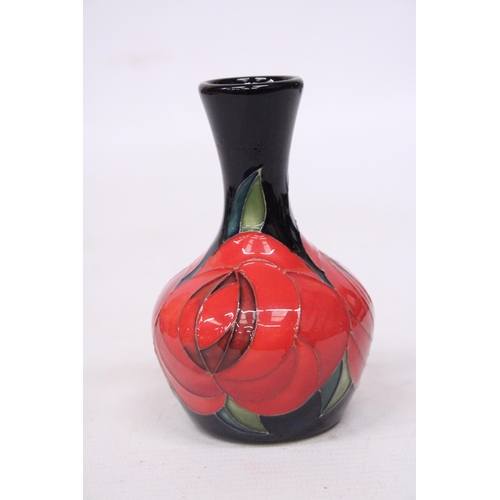 710 - A MOORCROFT 4 INCH RED ROSE VASE