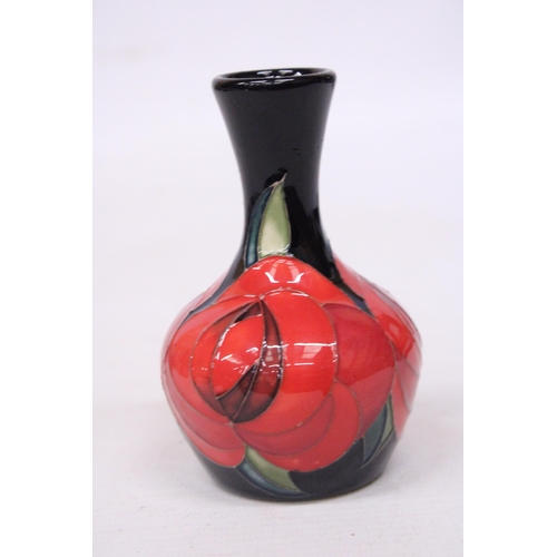 710 - A MOORCROFT 4 INCH RED ROSE VASE