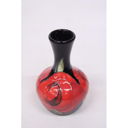 710 - A MOORCROFT 4 INCH RED ROSE VASE