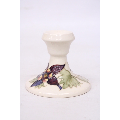 711 - A MOORCROFT CANDLESTICK COLUMBINE PATTERN -