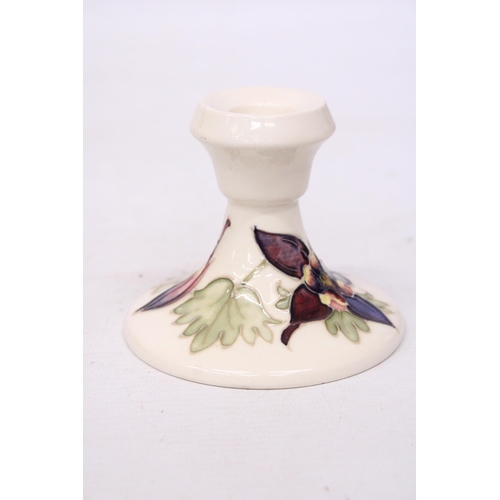 711 - A MOORCROFT CANDLESTICK COLUMBINE PATTERN -