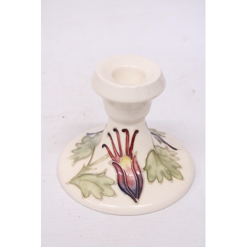 711 - A MOORCROFT CANDLESTICK COLUMBINE PATTERN -