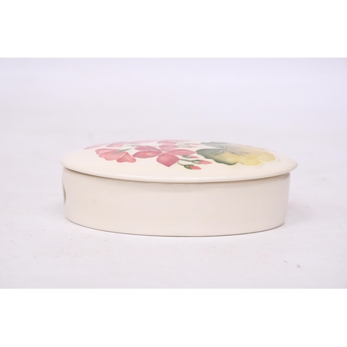 713 - AN OVAL MOORCROFT LIDDED TRINKET BOX - PINK GERANIUM