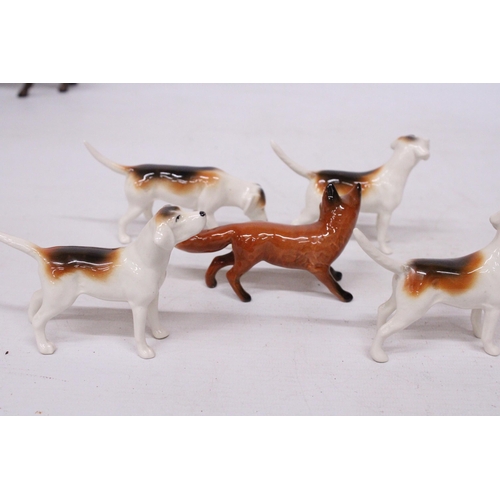 741 - A BESWICK FOX WITH FOUR FOXHOUNDS