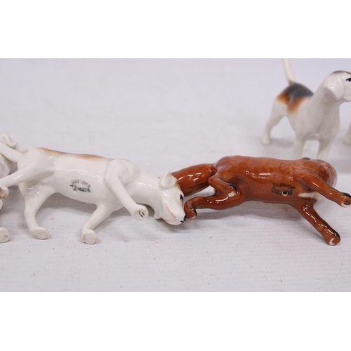 741 - A BESWICK FOX WITH FOUR FOXHOUNDS