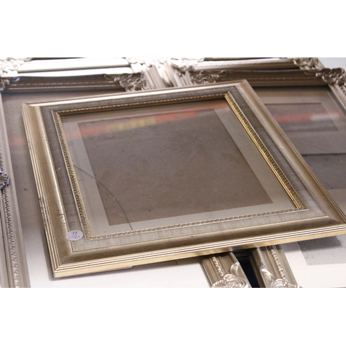 839 - SEVEN WALL HANGING PHOTO FRAMES WITH ORNATE FRAMES