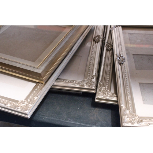 839 - SEVEN WALL HANGING PHOTO FRAMES WITH ORNATE FRAMES