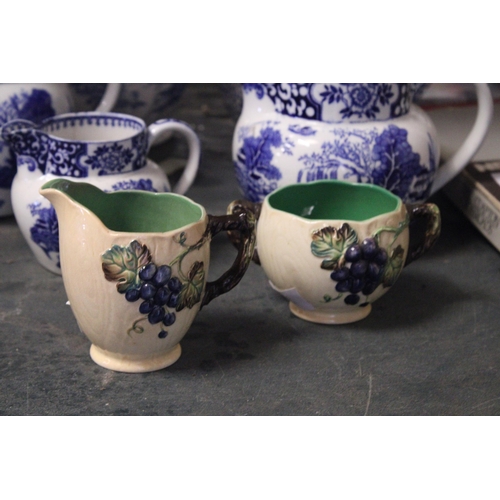 844 - FIVE PIECES OF BLUE AND WHITE POTTERY TO INCLUDE FOUR JUGS AND A COFFEE POT, PLUS A CARLTON WARE JUG... 