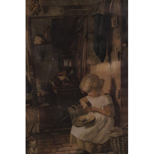 853 - A FRAMED PRINT OF A YOUNG GIRL IN A KITCHEN PEELING POTATOES WITH A CAT