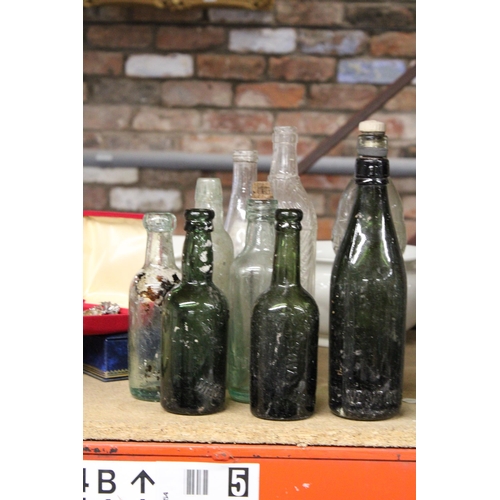 877 - AN ASSORTMENT OF VINTAGE GLASS BOTTLES