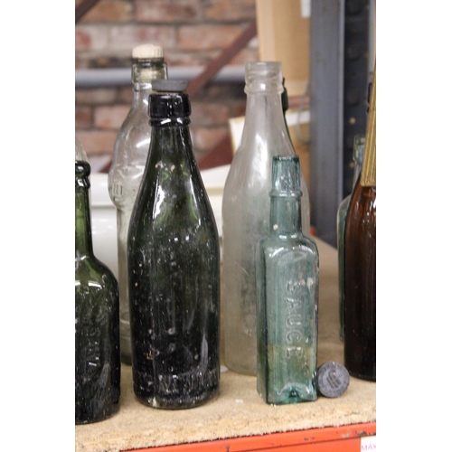 877 - AN ASSORTMENT OF VINTAGE GLASS BOTTLES