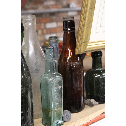 877 - AN ASSORTMENT OF VINTAGE GLASS BOTTLES