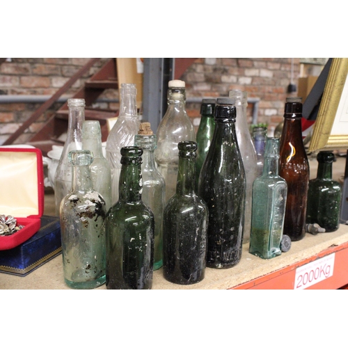 877 - AN ASSORTMENT OF VINTAGE GLASS BOTTLES