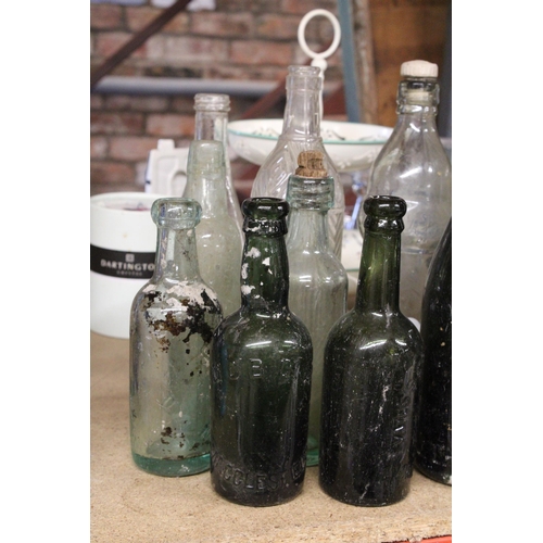 877 - AN ASSORTMENT OF VINTAGE GLASS BOTTLES