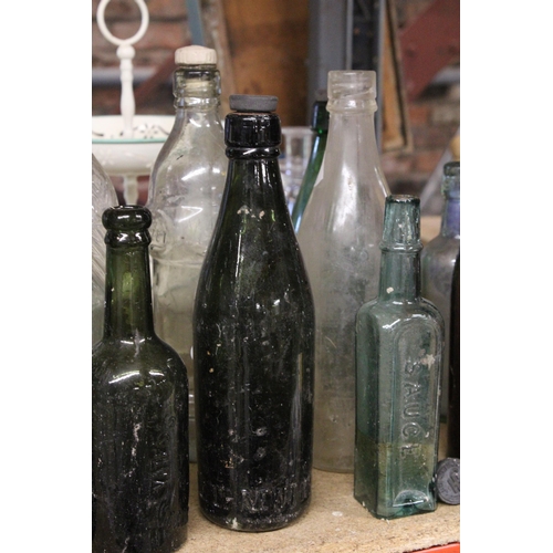 877 - AN ASSORTMENT OF VINTAGE GLASS BOTTLES