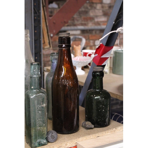 877 - AN ASSORTMENT OF VINTAGE GLASS BOTTLES