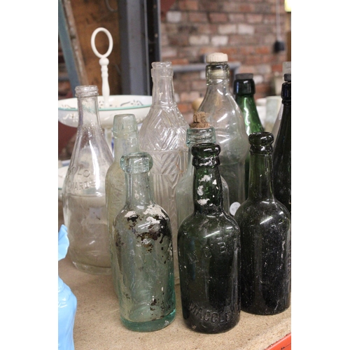 877 - AN ASSORTMENT OF VINTAGE GLASS BOTTLES