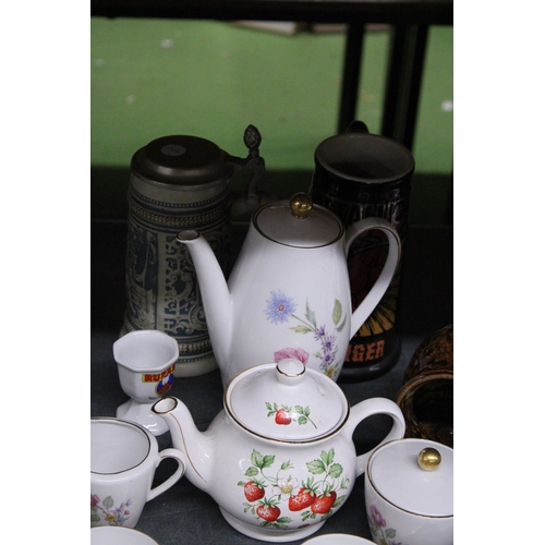 989 - A GERMAN CHINA COFFEE SET TO INCLUDE A COFFEE POT, CREAM JUG, SUGAR BOWL, CUPS AND SAUCERS, PLUS A S... 