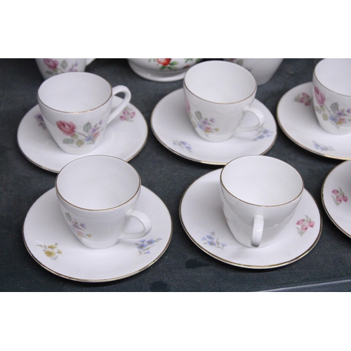 989 - A GERMAN CHINA COFFEE SET TO INCLUDE A COFFEE POT, CREAM JUG, SUGAR BOWL, CUPS AND SAUCERS, PLUS A S... 