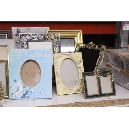 1033 - A LARGE QUANTITY OF DIFFERENT STYLES OF PHOTO FRAMES