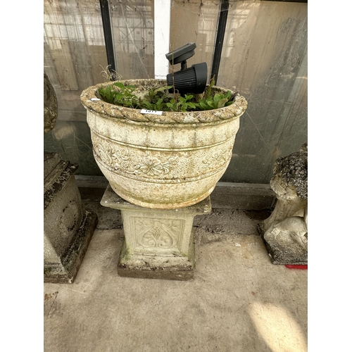 1511 - A CONCRETE CIRCULAR PLANTER ON AN UNRELATED CONCRETE PEDESTAL BASE