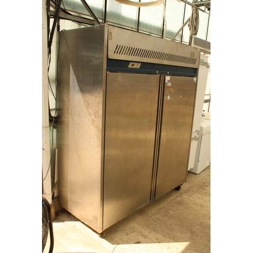 2358 - A LARGE STAINLESS STEEL INDUSTRIAL FRIDGE MOTOR RUNS AND BELIEVED IN WORKING ORDER BUT NO WARRANTY