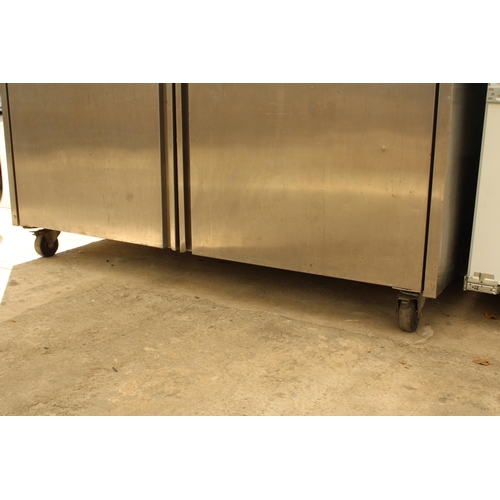 2358 - A LARGE STAINLESS STEEL INDUSTRIAL FRIDGE MOTOR RUNS AND BELIEVED IN WORKING ORDER BUT NO WARRANTY