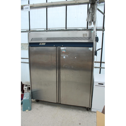 2358 - A LARGE STAINLESS STEEL INDUSTRIAL FRIDGE MOTOR RUNS AND BELIEVED IN WORKING ORDER BUT NO WARRANTY