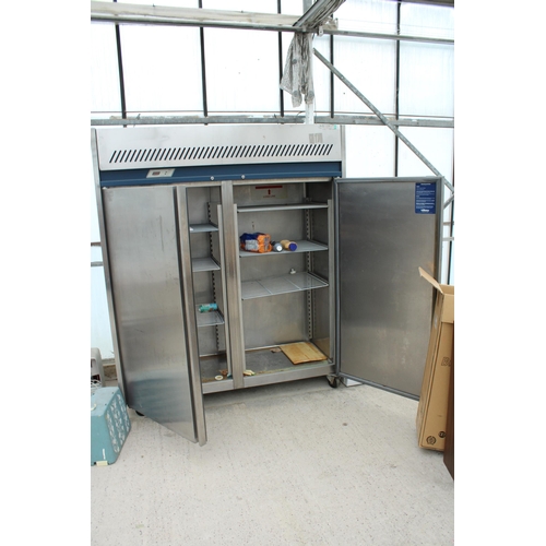 2358 - A LARGE STAINLESS STEEL INDUSTRIAL FRIDGE MOTOR RUNS AND BELIEVED IN WORKING ORDER BUT NO WARRANTY