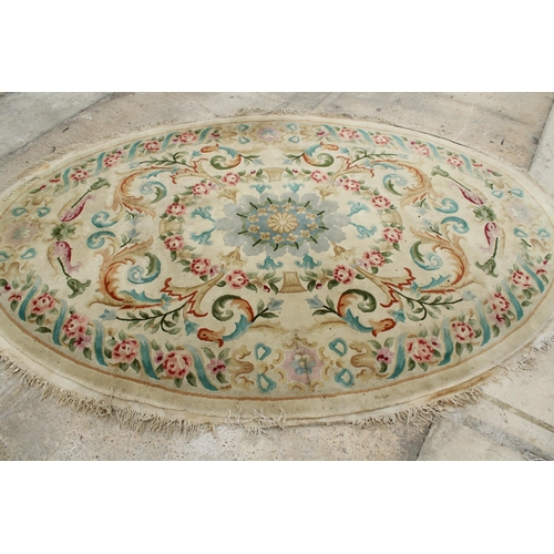 2496 - A LARGE CREAM PATTERNED CIRCULAR FRINGED RUG