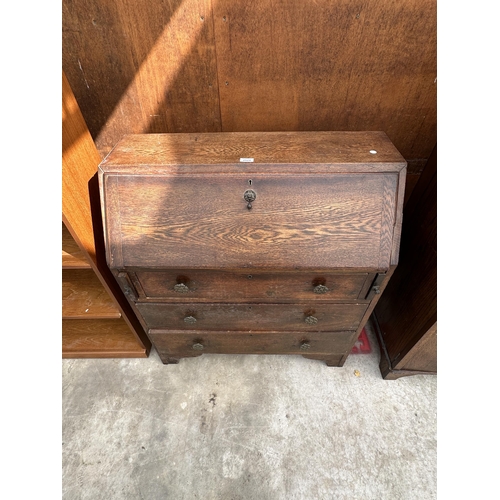 2524 - A MID 20TH CENTURY OAK BUREAU, 34