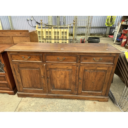 2583 - A HARDWOOD DRESSER BASE ENCLOSING THREE DRAWERS AND THREE CUPBOARDS, 63