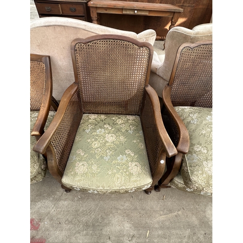 2620 - AN EARLY 20TH CENTURY BERGERE THREE PIECE SUITE AND A SIMILAR CHAIR