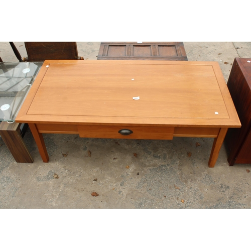 2651 - A HARDWOOD COFFEE TABLE WITH SINGLE PULL TROUGH DRAWER 48