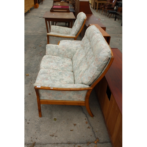 2659 - AN ERCOL STYLE ELM FRAMED LOUNGE SUITE COMPRISING TWO SEATER SETTEE, FIRESIDE CHAIR AND A STOOL