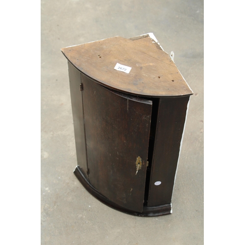 2672 - A SMALL OAK BOW FRONTED CORNER CUPBOARD WITH SHAPED INTERIOR SHELVES, 14