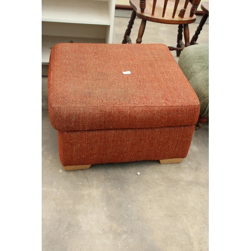 2714 - AN UPHOLSTERED FOOTSTOOL WITH HINGED LID