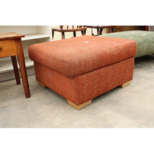 2714 - AN UPHOLSTERED FOOTSTOOL WITH HINGED LID