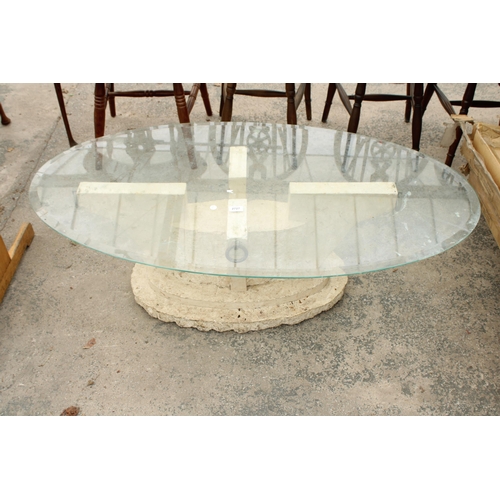 2727 - AN OVAL GLASS COFFEE TABLE ON A STONE EFFECT BASE 51