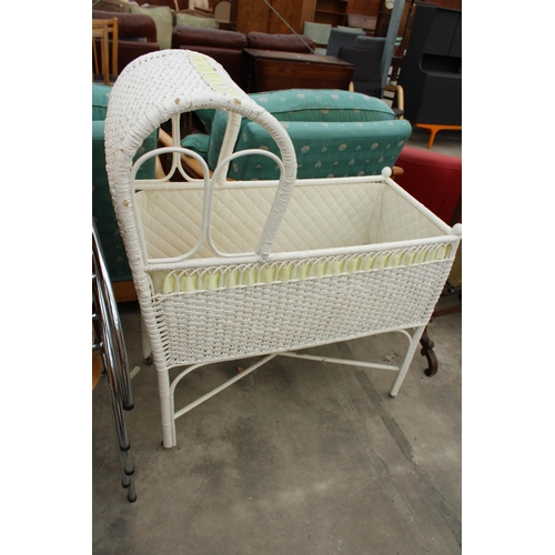 2763 - A PAINTED WICKER CRIB ON CASTORS