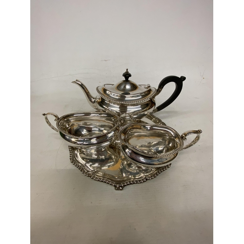 1 - A HALLMARKED LONDON TEASET COMPRISING OF A TEAPOT, SUGAR BASIN AND MILK JUG ON A HALLMARKED BIRMINGH... 