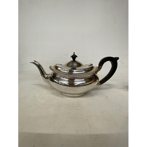 1 - A HALLMARKED LONDON TEASET COMPRISING OF A TEAPOT, SUGAR BASIN AND MILK JUG ON A HALLMARKED BIRMINGH... 