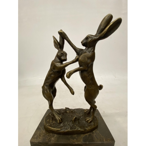 14 - A SIGNED BRONZE FIGURE OF FIGHTING HARES ON A MARBLE BASE