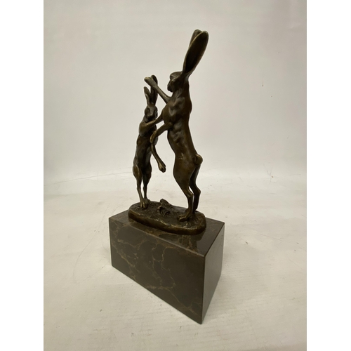 14 - A SIGNED BRONZE FIGURE OF FIGHTING HARES ON A MARBLE BASE