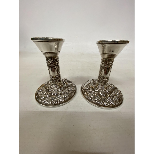 26 - A PAIR OF HALLMARKED BIRMINGHAM SILVER B & CO CANDLESTICKS 1980 WITH WEIGHTED BASES