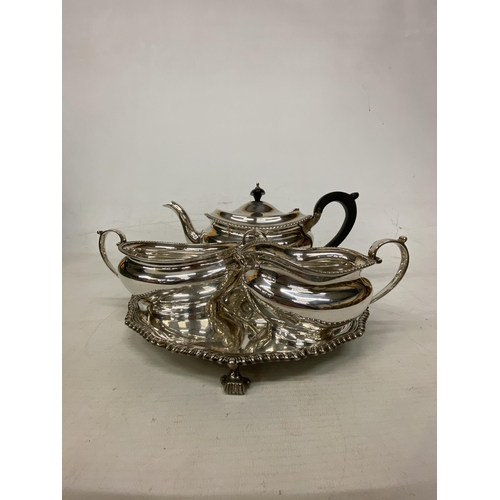 1 - A HALLMARKED LONDON TEASET COMPRISING OF A TEAPOT, SUGAR BASIN AND MILK JUG ON A HALLMARKED BIRMINGH... 