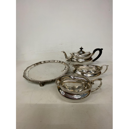 1 - A HALLMARKED LONDON TEASET COMPRISING OF A TEAPOT, SUGAR BASIN AND MILK JUG ON A HALLMARKED BIRMINGH... 