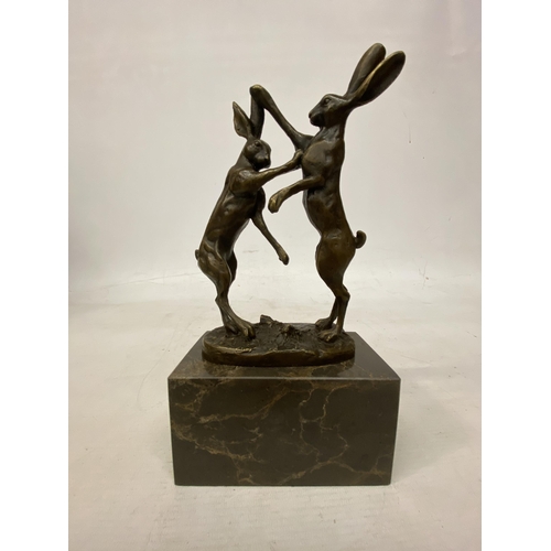 14 - A SIGNED BRONZE FIGURE OF FIGHTING HARES ON A MARBLE BASE