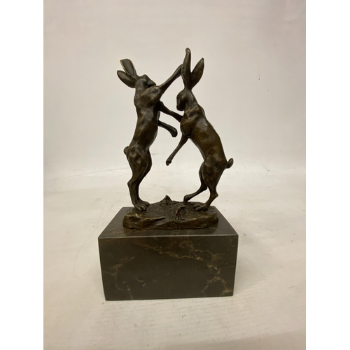 14 - A SIGNED BRONZE FIGURE OF FIGHTING HARES ON A MARBLE BASE