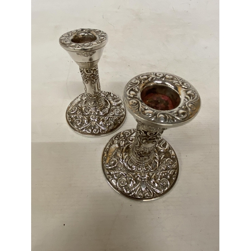 26 - A PAIR OF HALLMARKED BIRMINGHAM SILVER B & CO CANDLESTICKS 1980 WITH WEIGHTED BASES